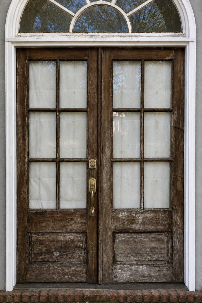 Weathered Double Door Refinish before refinishing in Covington, LA