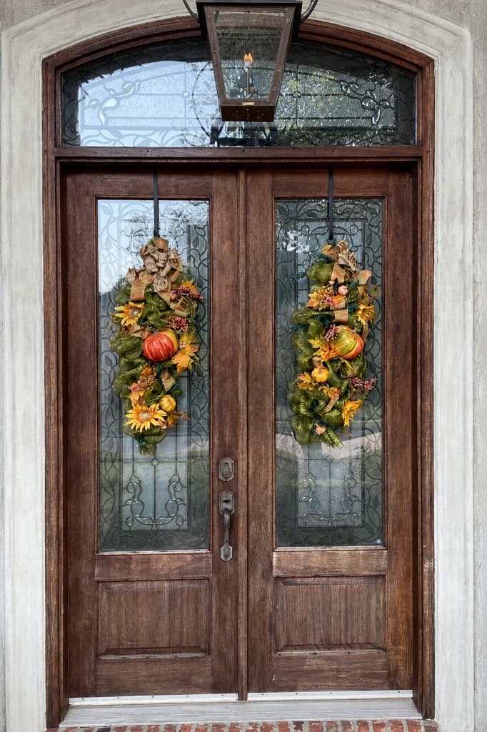 Stately Double Front Door Refinish before refinishing in Mandeville, LA